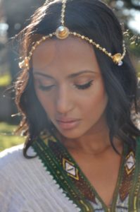 Helena wearing our mother's Eritrean gold head jewelry and Zuria (dress.)